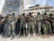 Palestinians view handover of Israeli hostages to ICRC