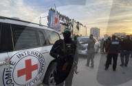 Palestinians view handover of Israeli hostages to ICRC
