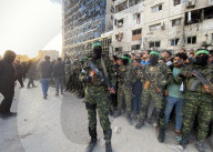 Palestinians view handover of Israeli hostages to ICRC