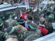 Palestinians view handover of Israeli hostages to ICRC