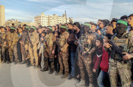 Palestinians view handover of Israeli hostages to ICRC