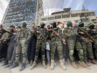 Palestinians view handover of Israeli hostages to ICRC