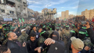 Palestinians view handover of Israeli hostages to ICRC