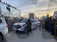 Palestinians view handover of Israeli hostages to ICRC