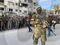 Palestinians view handover of Israeli hostages to ICRC