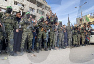 Palestinians view handover of Israeli hostages to ICRC