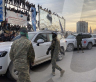 Palestinians view handover of Israeli hostages to ICRC