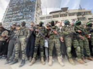 Palestinians view handover of Israeli hostages to ICRC