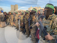 Palestinians view handover of Israeli hostages to ICRC