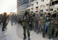 Palestinians view handover of Israeli hostages to ICRC