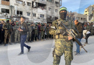 Palestinians view handover of Israeli hostages to ICRC