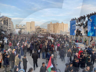 Palestinians view handover of Israeli hostages to ICRC