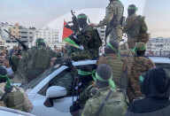 Palestinians view handover of Israeli hostages to ICRC