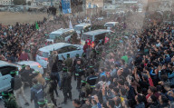 Palestinians view handover of Israeli hostages to ICRC