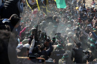 Hamas forces Israeli female hostage thru mob of armed men in dangerous propaganda display