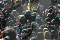 Hamas forces Israeli female hostage thru mob of armed men in dangerous propaganda display