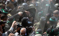 Hamas forces Israeli female hostage thru mob of armed men in dangerous propaganda display