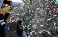 Hamas forces Israeli female hostage thru mob of armed men in dangerous propaganda display