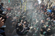 Hamas forces Israeli female hostage thru mob of armed men in dangerous propaganda display