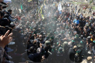 Hamas forces Israeli female hostage thru mob of armed men in dangerous propaganda display