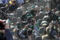 Hamas forces Israeli female hostage thru mob of armed men in dangerous propaganda display