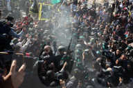 Hamas forces Israeli female hostage thru mob of armed men in dangerous propaganda display