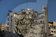 Palestinians amidst Gaza City rubble