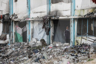 Palestinians amidst Gaza City rubble