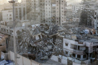 Palestinians amidst Gaza City rubble