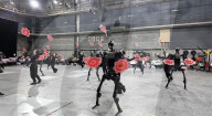 Dancing robot group perform with human 