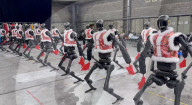 Dancing robot group perform with human 