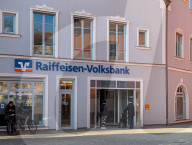 Senior Citizen With Walker Entering A Bank