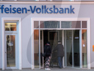Senior Citizen With Walker Entering A Bank