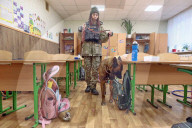 Children evacuated as Kyiv school searched for bomb