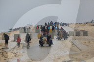 Displaced Gazans walk north