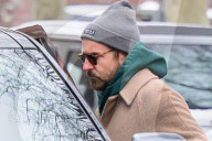 Bradley Cooper strolls in a cozy layered winter look in New York