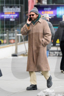 Bradley Cooper strolls in a cozy layered winter look in New York