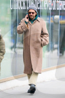 Bradley Cooper strolls in a cozy layered winter look in New York