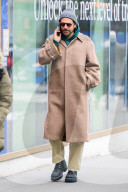 Bradley Cooper strolls in a cozy layered winter look in New York