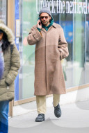 Bradley Cooper strolls in a cozy layered winter look in New York