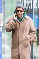 Bradley Cooper strolls in a cozy layered winter look in New York