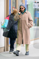 Bradley Cooper strolls in a cozy layered winter look in New York