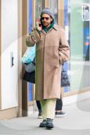 Bradley Cooper strolls in a cozy layered winter look in New York