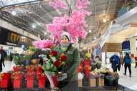Angela a florist from Isle of Flowers at Waterloo Station, London, UK. 