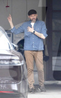 Two and a Half Men and Pretty in Pink alum Jon Cryer, 59, takes care of some domestic chores outside his LA home in a rare public outing