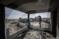 A view of the demolished residential area shows Palestinians continuing their daily lives under difficult conditions in the Bureij refugee camp, struggling to survive amid the rubble of buildings destroyed by Israeli attacks in the Gaza Strip