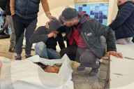 Palestinians mourn at a hospital after an Israeli strike killed three policemen, according to the Hamas-run interior ministry, in Khan Younis