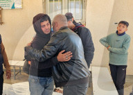 Palestinians mourn at a hospital after an Israeli strike killed three policemen, according to the Hamas-run interior ministry, in Khan Younis