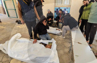 Palestinians mourn at a hospital after an Israeli strike killed three policemen, according to the Hamas-run interior ministry, in Khan Younis