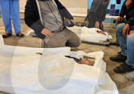 Palestinians mourn at a hospital after an Israeli strike killed three policemen, according to the Hamas-run interior ministry, in Khan Younis